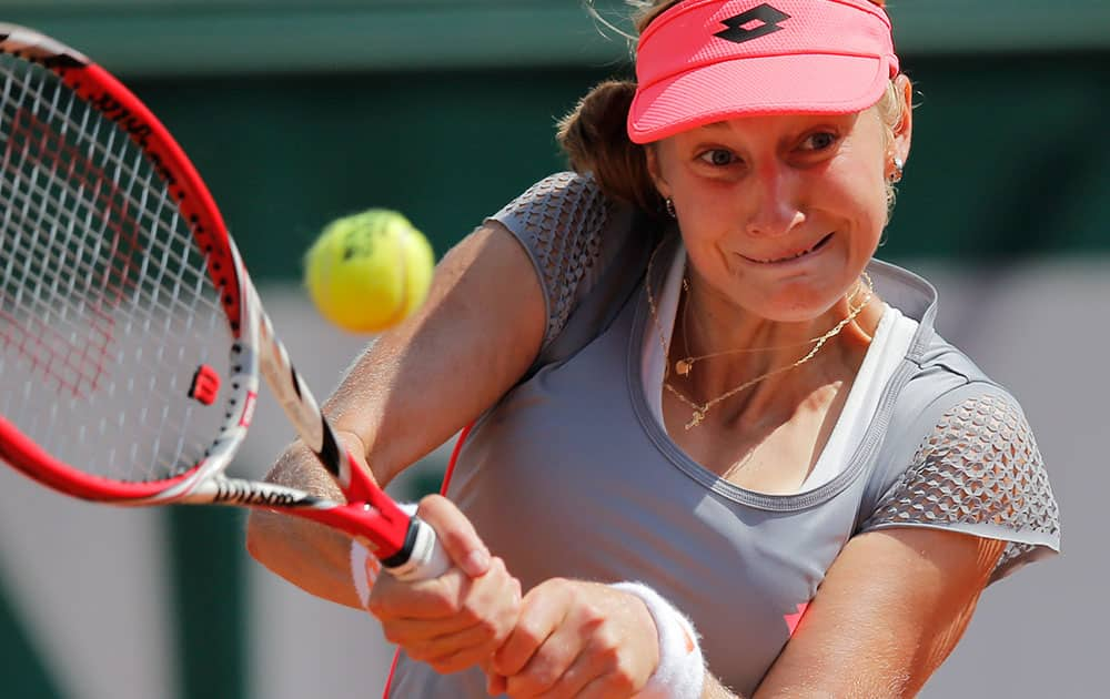 Russia's Ekaterina Makarova returns the ball to USA's Louisa Chirico during their first round match of the French Open tennis tournament.