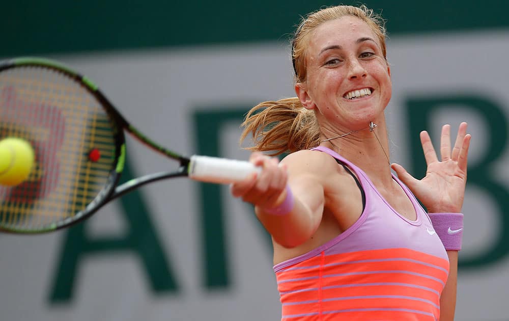 Croatia's Petra Martic serves in the first round match of the French Open tennis tournament against Spain's Garbine Muguruza.