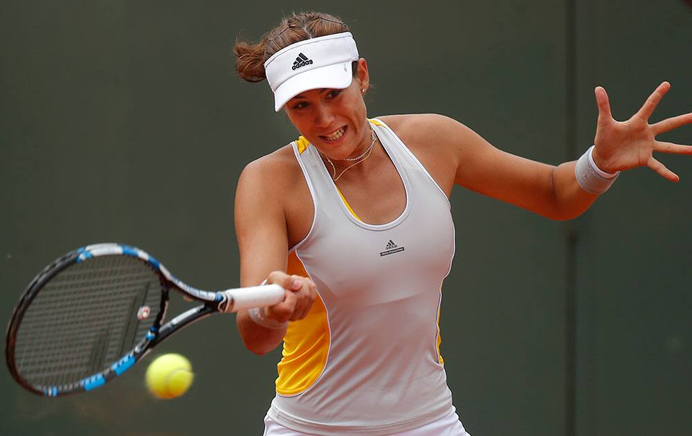 Spain's Garbine Muguruza returns in the first round match of the French Open tennis tournament against Croatia's Petra Martic.