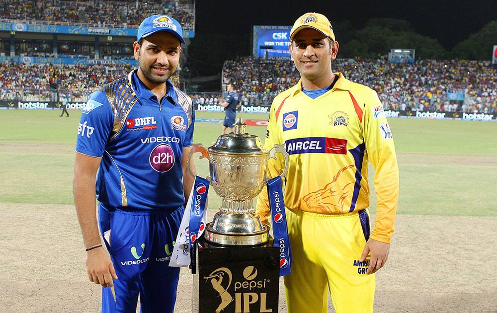 Rohit Sharma captain of the Mumbai Indians and MS Dhoni captain of the Chennai Superkings pose with the trophy during the final of the IPL 8 in Kolkata.