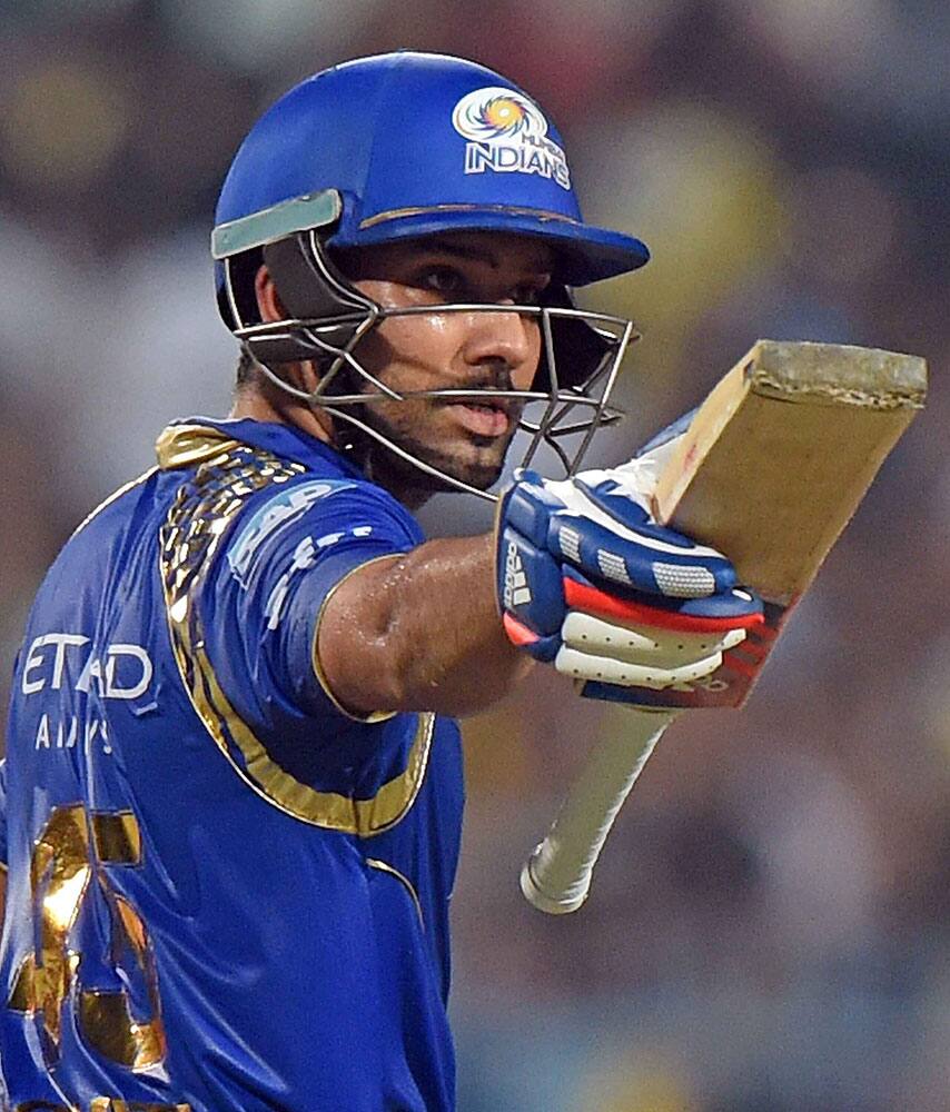 Mumbai Indian batsman Rohit Sharma raise his bat after complete his half century during IPL2015 Final against CSK at Eden Garden.