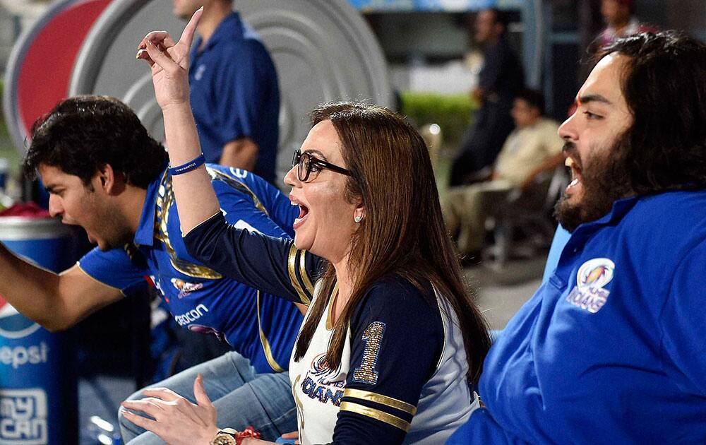 Mumbai Indian owner Nita Ambani with her sons celebrate after dismissal of CSK batsman during the IPL final match against Chennai Super Kings at Eden Garden in Kolkata.