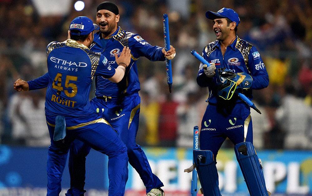 Mumbai Indian captain Rohit Sharma, Harbhajan Singh and Parthiv Patel celebrate after beating Chennai Super Kings during the IPL 8 final at Eden Garden in Kolkata.