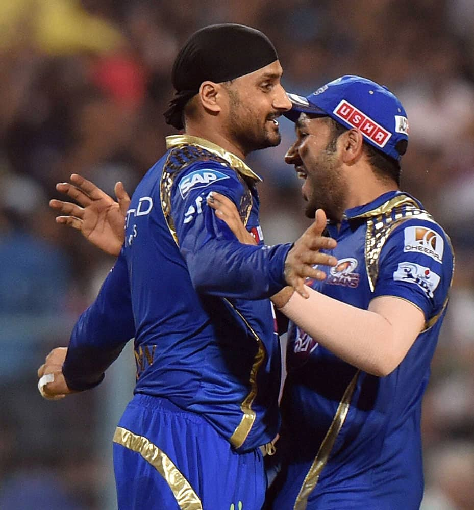 Mumbai Indian captain Rohit Sharma and Harbhajan Singh celebrate a wicket of Chennai Super Kings batsman D Smith during the IPL final match at Eden Garden in Kolkata.