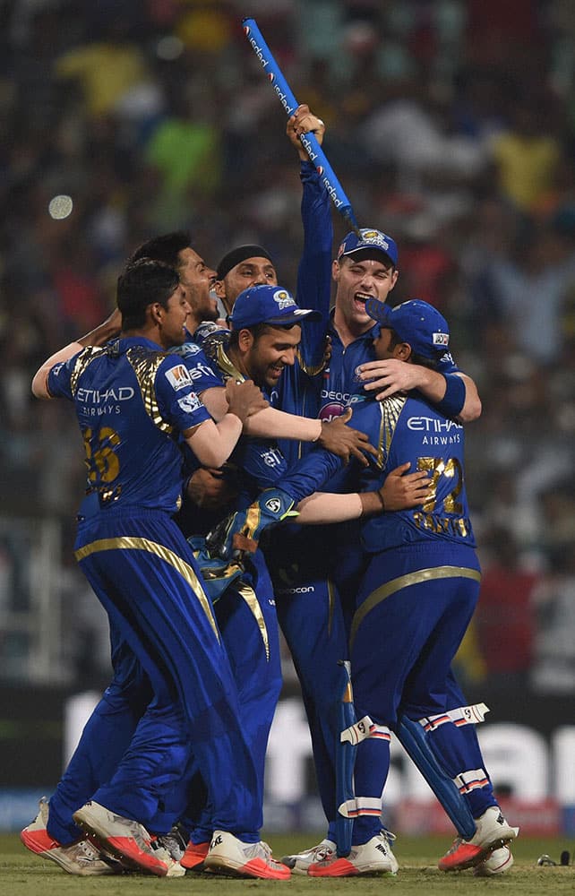 Mumbai Indian captain Rohit Sharma celebrate with team mates after beating Chennai Super Kings during the IPL 8 final at Eden Garden in Kolkata.