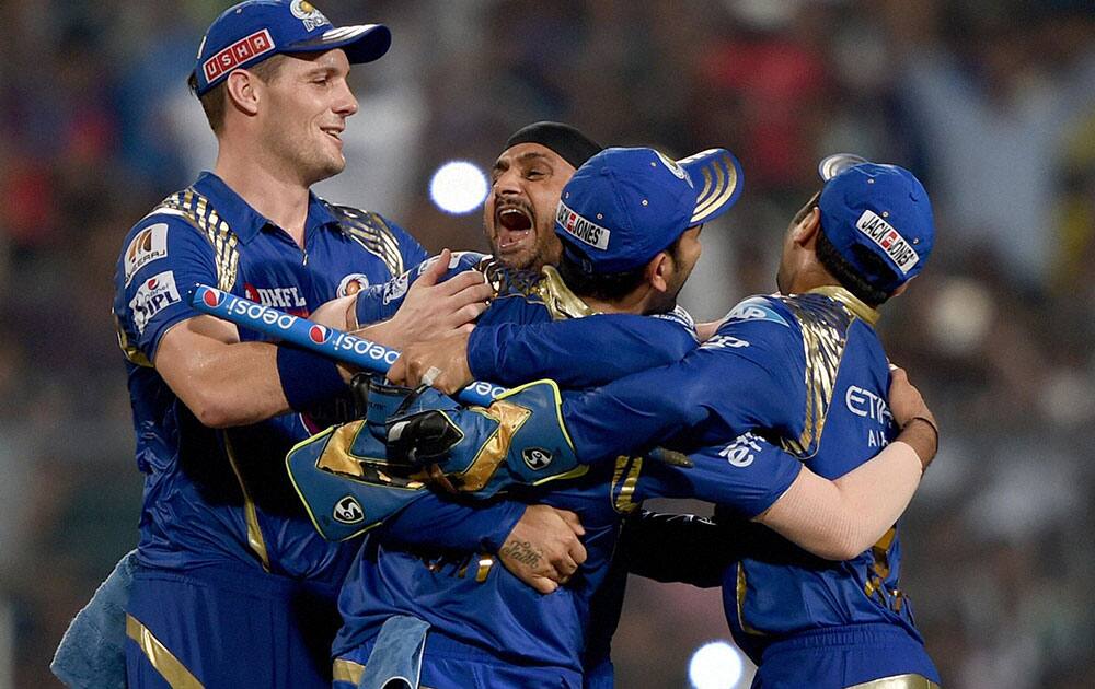 Mumbai Indian captain Rohit Sharma, Harbhajan Singh and Parthiv Patel celebrate after beating Chennai Super Kings during the IPL 8 final at Eden Garden in Kolkata.