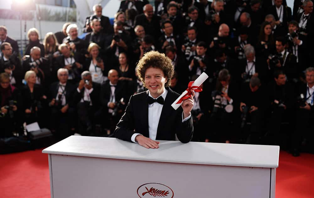 Director Michel Franco holds the Best Screenplay award for the film Chronic during a photo call following the awards ceremony at the 68th international film festival, Cannes.