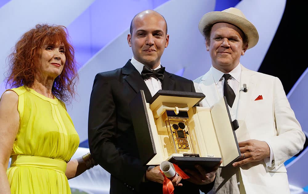 Director Cesar Augusto Acevedo, center, holds Camera d’Or award which was presented to him by actor John C. Reilly, right, and actress Sabine Azema during the awards ceremony at the 68th international film festival, Cannes.