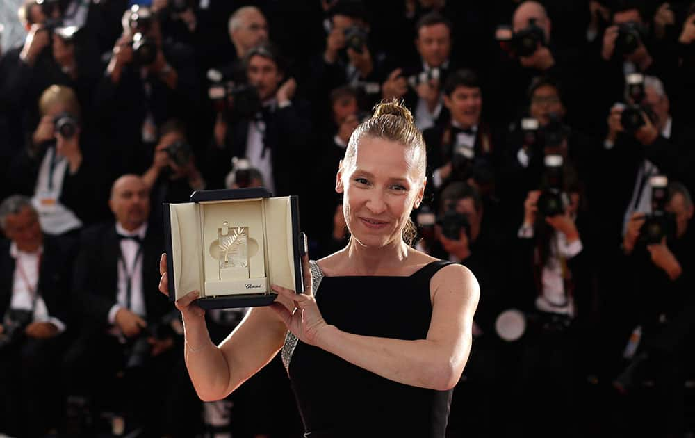 Actress Emmanuelle Bercot holds the Best Actress award for the film Mon Roi during a photo call following the awards ceremony at the 68th international film festival, Cannes.