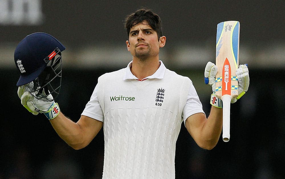 Englands Alastair Cook celebrates scoring 150 during the fourth day of the first Test match between England and New Zealand at Lords cricket ground in London.