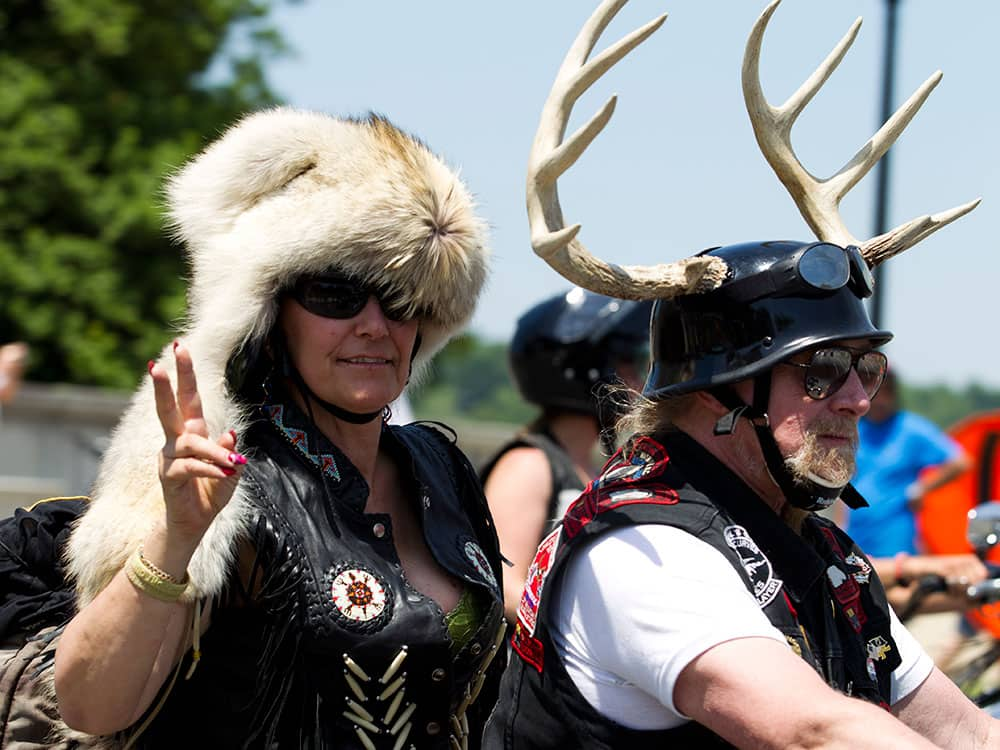 Participants in the Rolling Thunder annual motorcycle rally ride past Arlington memorial bridge during a parade ahead of Memorial Day in Washington.