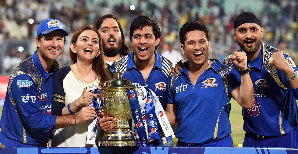 Mumbai Indians owner Nita Ambani along with team mentor Sachin Tendulkar, coach Ricky Ponting and player Harbhajan Singh celebrate with trophy after winning IPL8 final against Chennai Super Kings at Eden Garden in Kolkata.