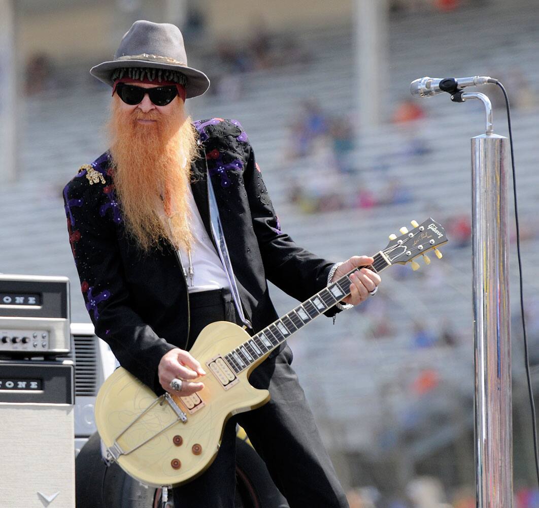 ZZ Top's Billy Gibbons performs before the start of the NASCAR Sprint Cup series auto race at Charlotte Motor Speedway in Concord, N.C.