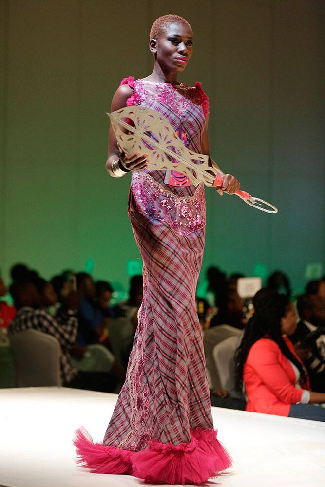 A model displays creations by designer FAW COUTURE during Africa Fashion Week in Lagos, Nigeria.