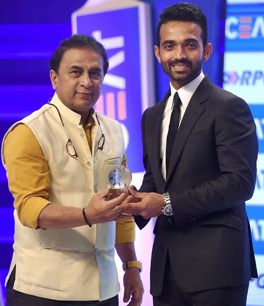 Cricketer Sunil Gawaskar felicitated Ajinkya Rahane with the Indian cricketer of year during the Ceat cricket rating awards in Mumbai.