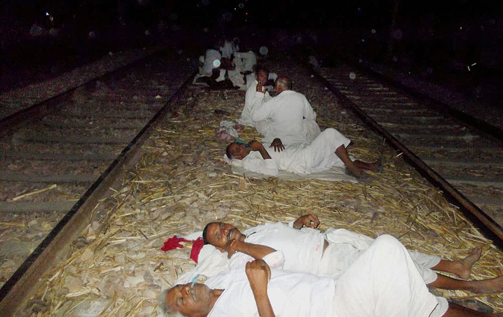 Gujjar community people sleep on train track as they agitating to demand reservation in government jobs and educational institutions for their community on Delhi-Mumbai railway track near Bayana village in Bharatpur district of Rajasthan.