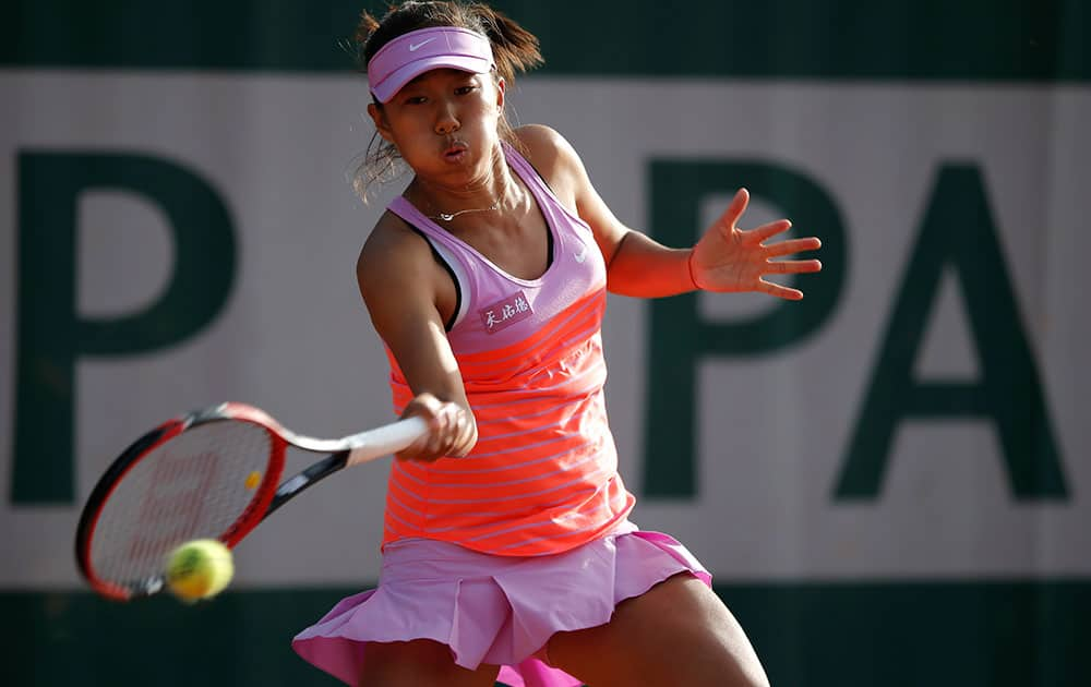 China's Shuai Zhang returns the ball to Karolina Pliskova of the Czech Republic during their first round match of the French Open tennis tournament.