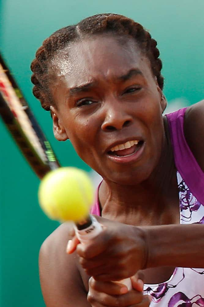 Venus Williams of the U.S. returns in the first round match of the French Open tennis tournament against Sloane Stephens of the US.