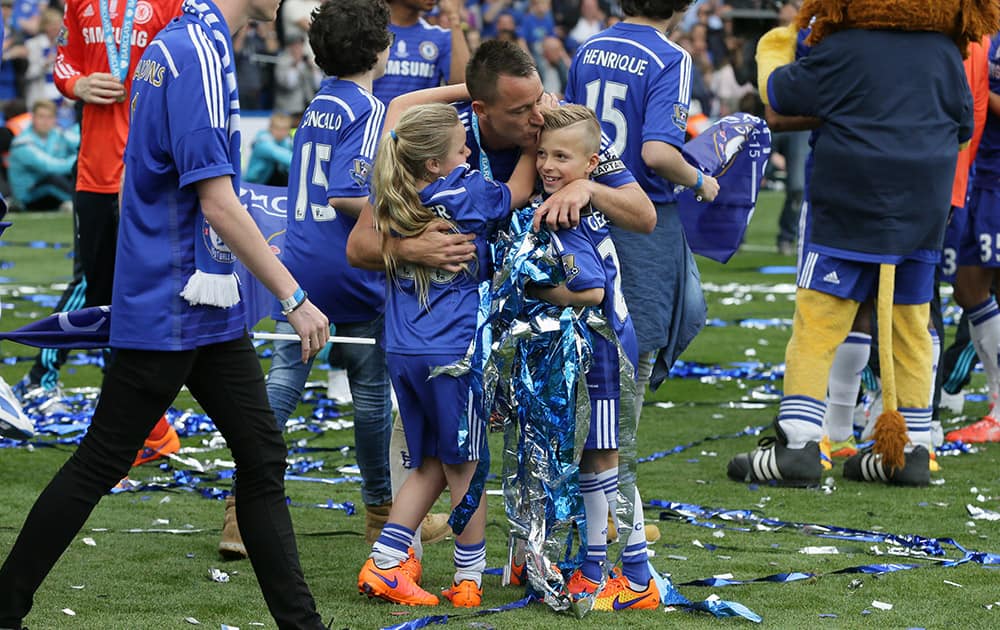 Chelsea’s John Terry with his children Summer Rose and Georgie John after the English Premier League soccer match between Chelsea and Sunderland at Stamford Bridge stadium in London.