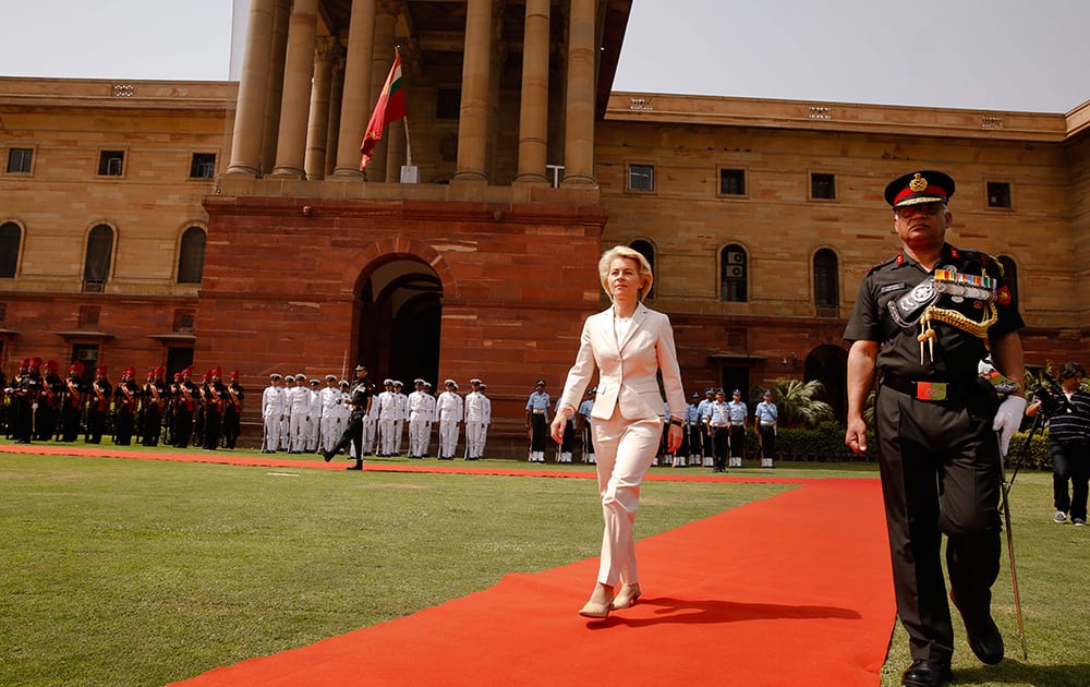 German Minister of Defense Ursula von der Leyen returns after inspecting a join defense guard of honor at the Indian Defense Ministry in New Delhi.