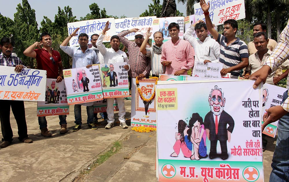 Madhya Pradesh Youth Congress workers observe the completion of one year of Modi government as the first death anniversary of Achche Din in Bhopal.