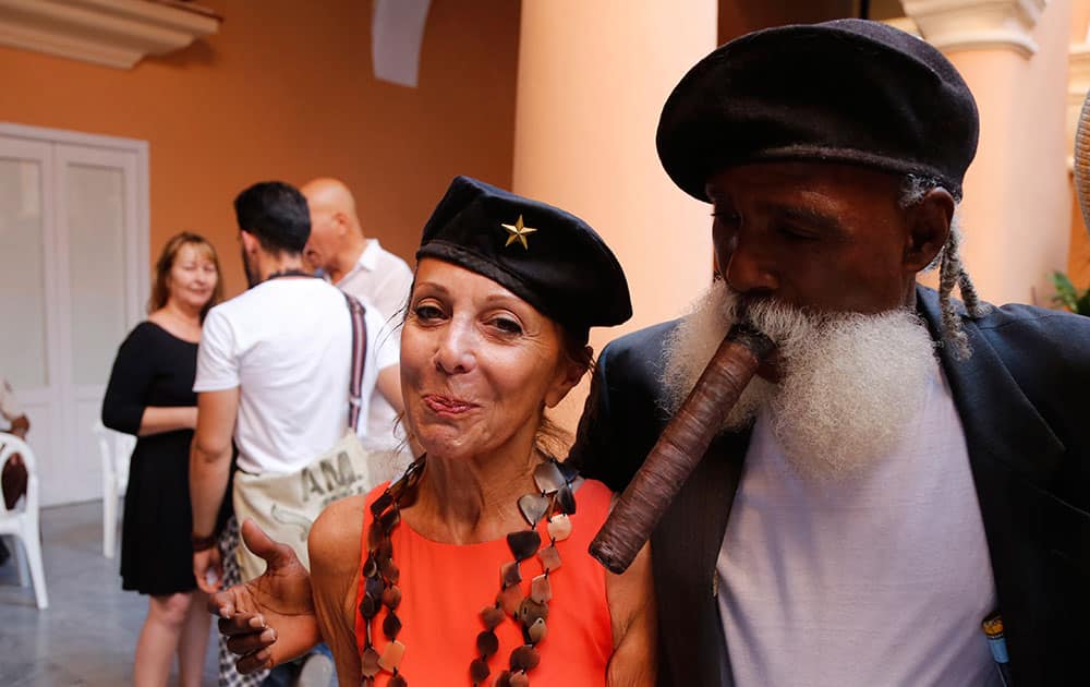 Patricia Farber, wife of US art collector Howard Farber, stands with well known Cuban street entertainer Hermenegildo Arencibia, at a cultural event organized by the Farber Foundation in Havana, Cuba. 