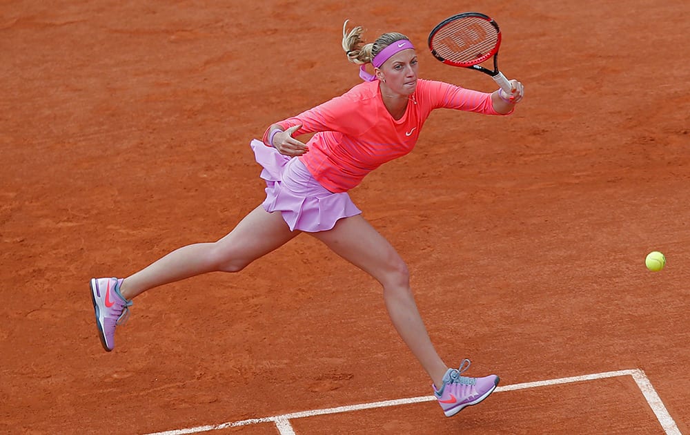 Petra Kvitova of the Czech Republic returns in the first round match of the French Open tennis tournament against Marina Erakovic of New Zealand at the Roland Garros stadium, in Paris, France.