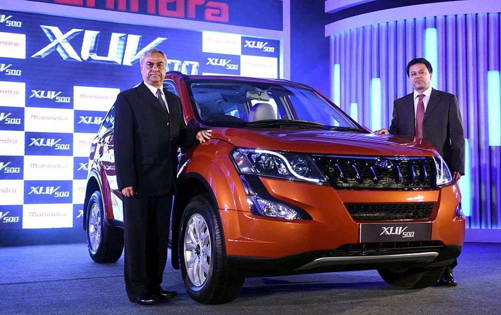 President and Chief Executive, Automotive Division, Mahindra & Mahindra, Pravin Shah with Vice- President Ashish Malik during the launch of the new age Mahindra XUV 500 in Mumbai.