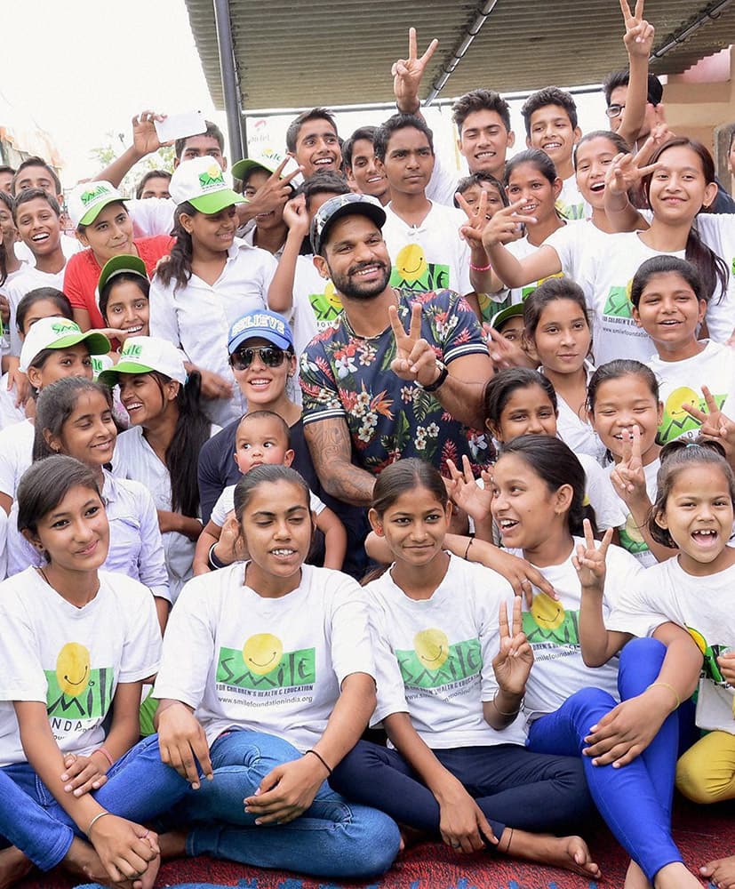 Shikhar Dhawan with Smile Foundation kids at an event.