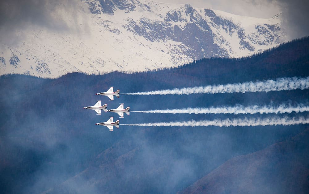 The Air Force Thunderbirds practice in the skies above The United States Air Force Academy in Colorado Springs, Colo., in preparation for Thursday's Air Force Academy Graduation. 