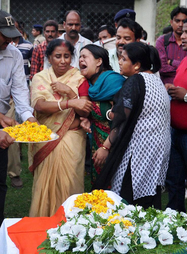 Relatives of RPF constable Samarendra Samanta, mourn upon receiving his body who lost his life while fighting with Bharatiya Mazdoor Sangha (Indian Workers Union) railway hawkers at Malda.
