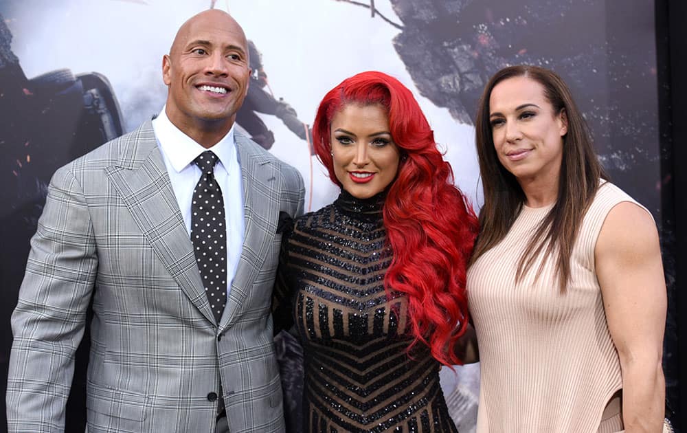 Dwayne Johnson, from left, Eva Marie and Dany Garcia arrive at the world premiere of 