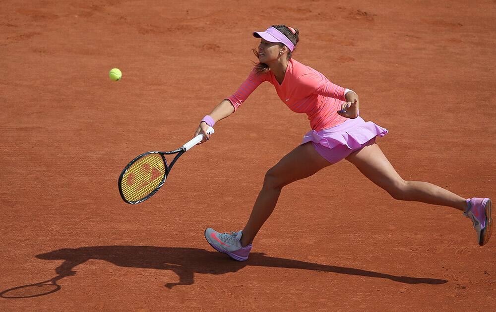 Vitalia Diatchenko of Russia returns the ball to compatriot Maria Sharapova during their second round match of the French Open tennis tournament at the Roland Garros stadium, in Paris.