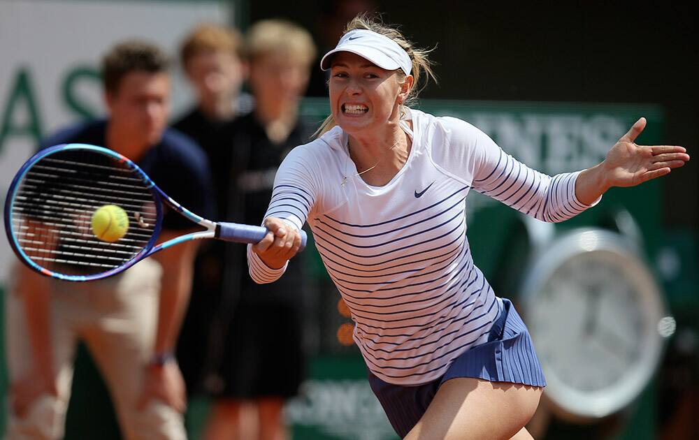 Russia's Maria Sharapova returns the ball to compatriot Vitalia Diatchenko during their second round match of the French Open tennis tournament at the Roland Garros stadium, in Paris. Sharapova won 6-3, 6-1.