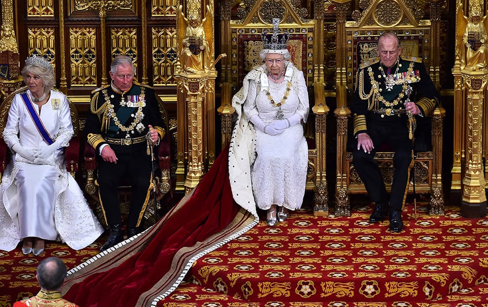 Britain's Queen Elizabeth II, 2nd right, seated on the throne in the House of Lords next to her husband, Prince Philip, Duke of Edinburgh, son, Prince Charles, Prince of Wales, 2nd left and his wife Camilla, Duchess of Cornwall, prepares to deliver the Queen's Speech during the State Opening of Parliament at the Palace of Westminster in London.