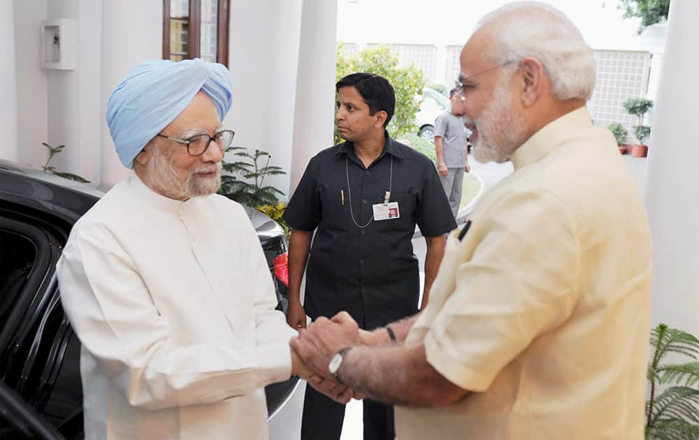 Prime Minister Narendra Modi and former Prime Minister Manmohan Singh at 7RCR in New Delhi. Very happy to meet Dr Manmohan Singh Ji, PM Modi tweeted.