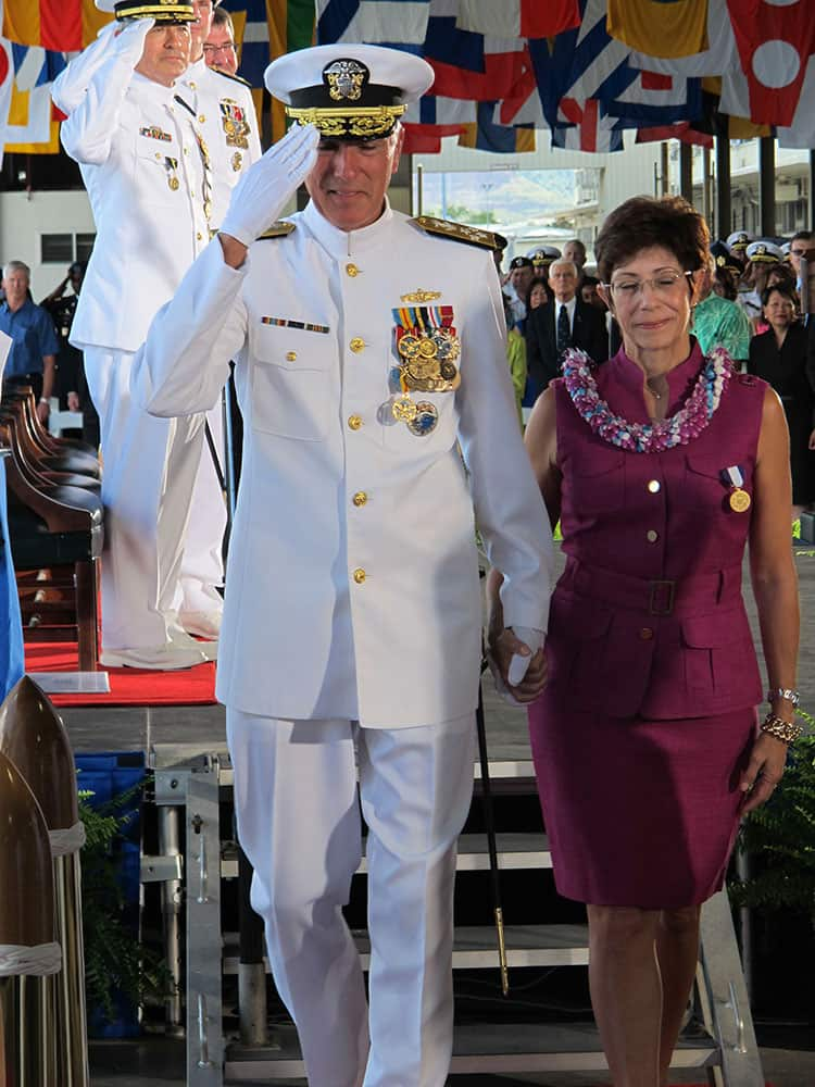 Adm. Samuel Locklear, left, salutes as he and his wife Pamela Locklear leave a change of command ceremony in Pearl Harbor, Hawaii.