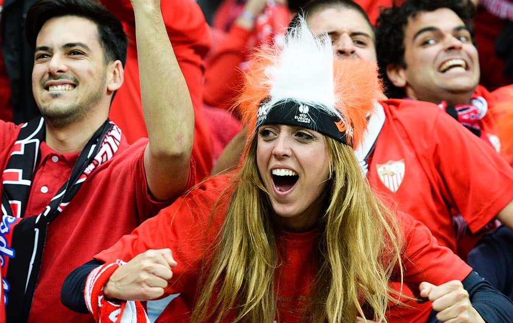 Sevilla fans celebrate after Carlos Bacca scored his side's 3rd goal during the final of the soccer Europa League between FC Dnipro Dnipropetrovsk and Sevilla FC at the National Stadium in Warsaw, Poland.