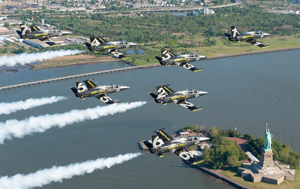 The Breitling Jet Team fly in formation over Statue of Liberty in New York City, USA, almost 129 years after the Statue of Liberty was officially gifted to the United States from the people of France.