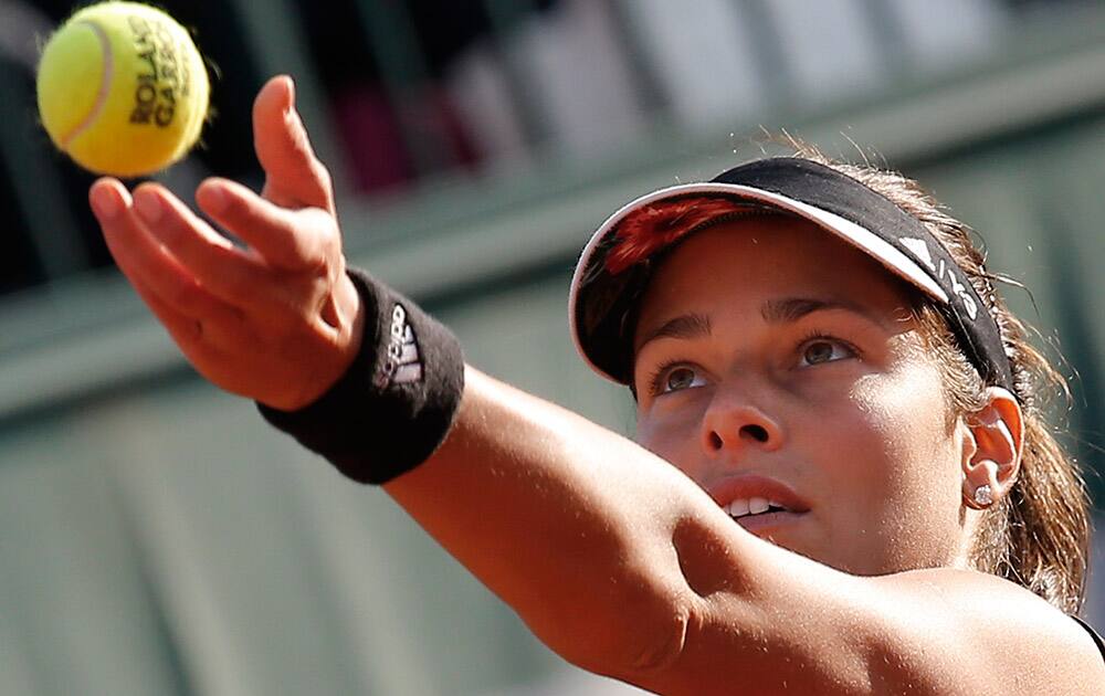 Serbia's Ana Ivanovic serves in the second round match of the French Open tennis tournament against Japan's Misaki Doi at the Roland Garros stadium, in Paris, France.