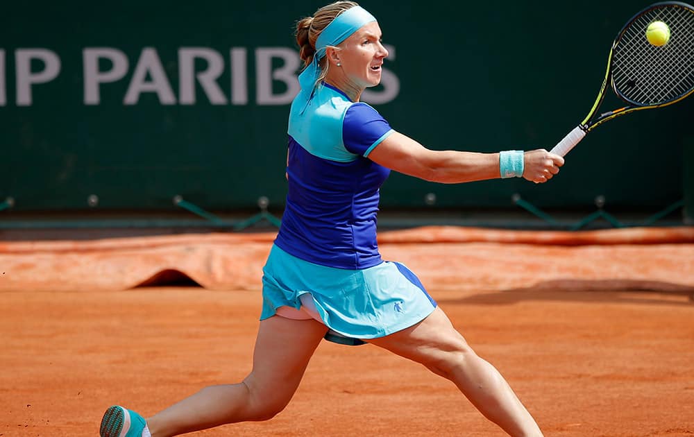 Russia's Svetlana Kuznetsova returns the ball to Italy's Francesca Schiavone during their second round match of the French Open tennis tournament at the Roland Garros stadium in Paris.