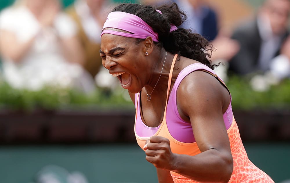 Serena Williams of the US celebrates winning the second round match of the French Open tennis tournament against Germany's Anna-Lena Friedsam in three sets 5-7, 6-3, 6-3, at the Roland Garros stadium, in Paris, France.