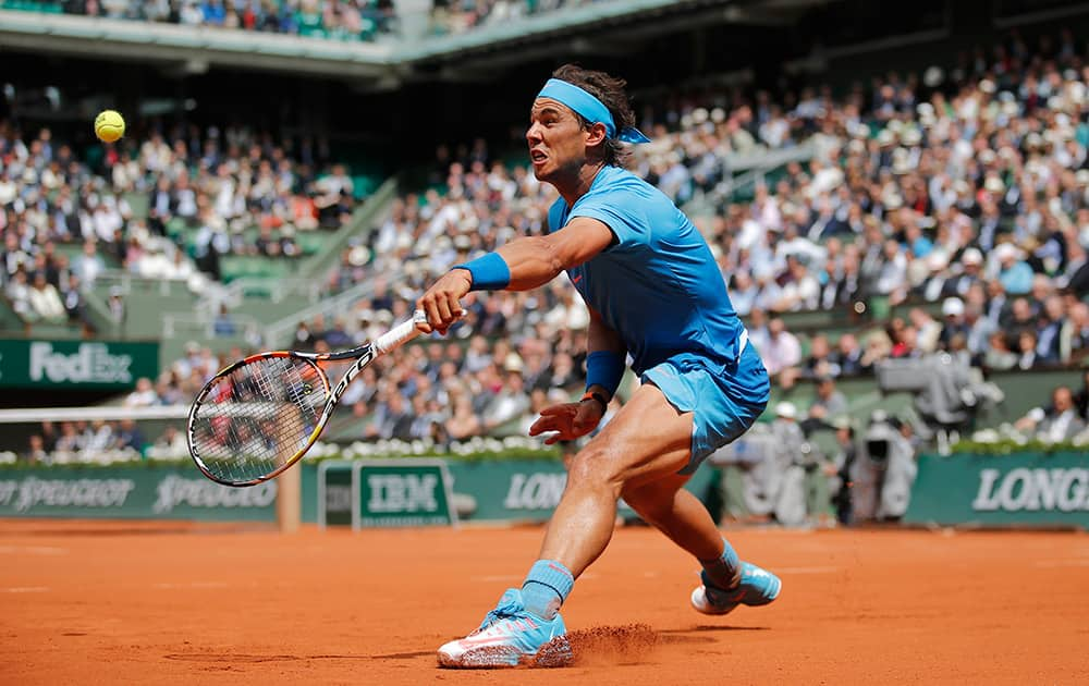 Spain's Rafael Nadal returns in the second round match of the French Open tennis tournament against Spain's Nicolas Almagro at the Roland Garros stadium, in Paris, France.