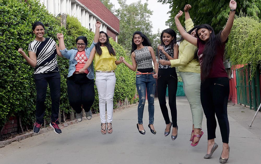 Students celeberate their success at a school after CBSE announced its 10th class results in New Delhi.