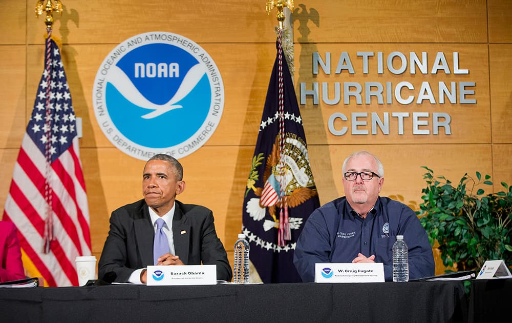 President Barack Obama, with Federal Emergency Management Agency (FEMA) Administrator Craig Fugate, participate in a briefing at the National Hurricane Center in Miami.