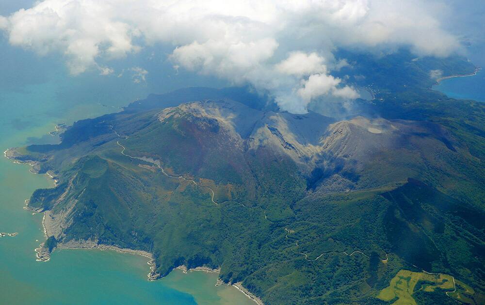 A column of smoke raises from Mount Shindake on Kuchinoerabu island, southern Japan.