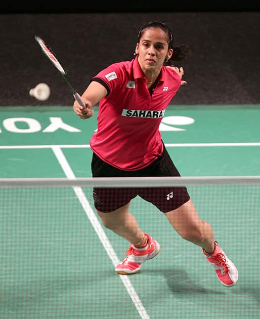 Saina Nehwal of India lunges forward to return a shot during her women's singles quarterfinal match against Wang Shixan of China at the Australian Open Badminton tournament in Sydney.