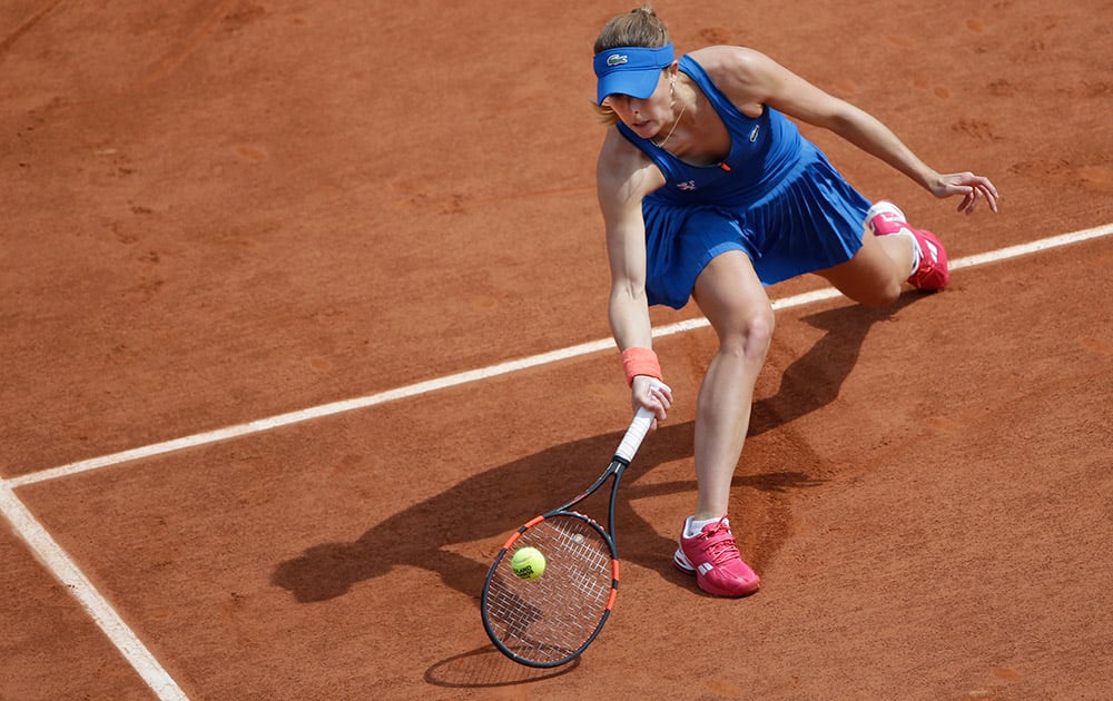 France's Alize Cornet returns in the third round match of the French Open tennis tournament against Croatia's Mirjana Lucic-Baroni at the Roland Garros stadium, in Paris, France.