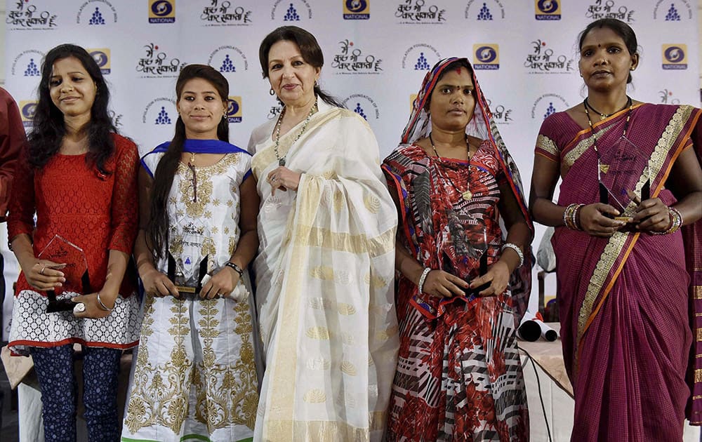 Veteran Bollywood actress and social activist Sharmila Tagore Pataudi felicitates role models Priya, Vidya (L) Saroj Bairagi and Sangeeta Devi (R) during the launching of DD national drama Main Kuch Bhi Kar Sakti Hoon season 2, organised by Population Foundation of India, in Bhopal.