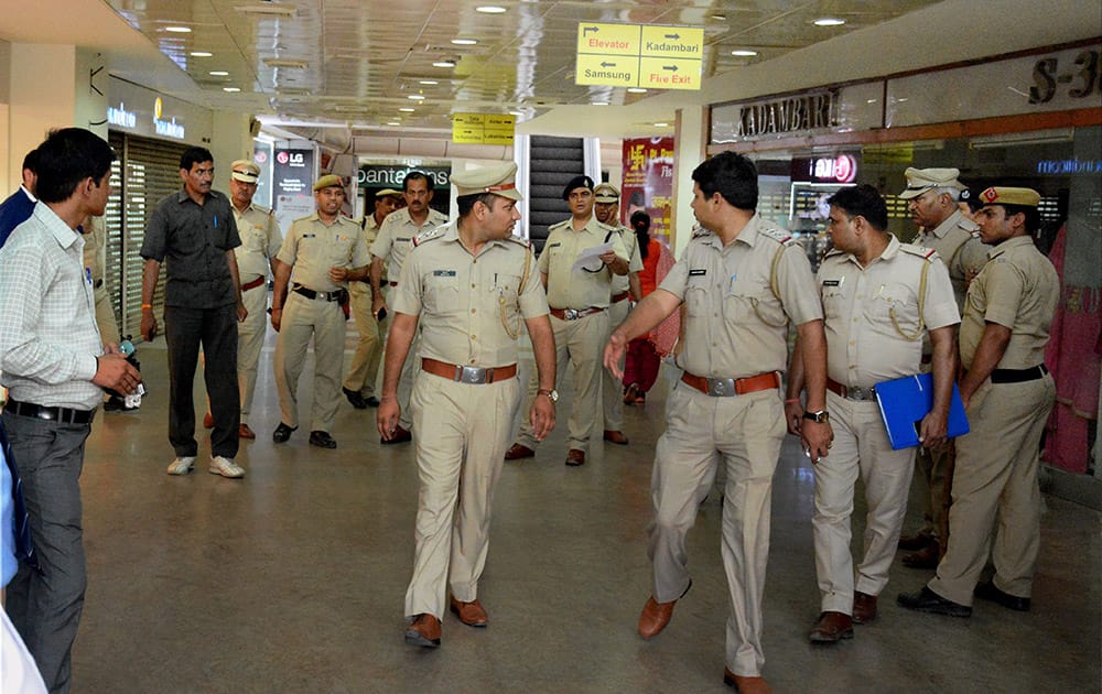 Police personnel busy in search of bomb after got information at a mall in Gurgaon.